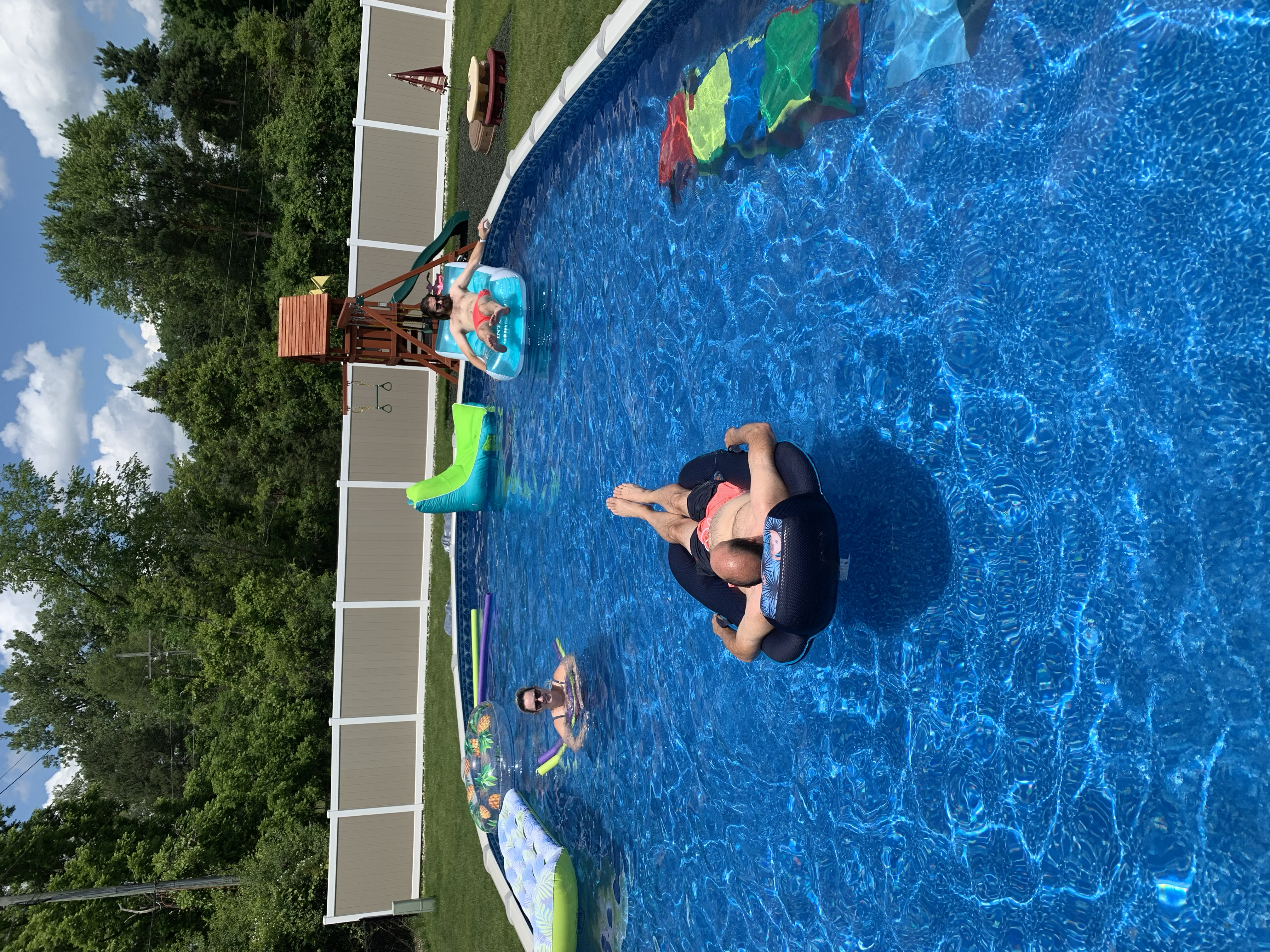 Us swimming in Sam's parents new pool